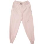Różowe Spodnie dresowe długie damskie sportowe marki Nike Swoosh w rozmiarze L 