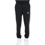 Czarne Spodnie dresowe ze ściągaczami męskie do prania w pralce Tapered fit sportowe marki adidas Essentials w rozmiarze XL 