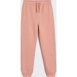 Różowe Spodnie dziecięce dresowe dla dziewczynek marki Sinsay w rozmiarze 152 