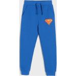 Niebieskie Spodnie dziecięce dresowe dla chłopców dżinsowe marki Sinsay w rozmiarze 98 Superman 