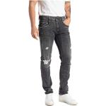 Zniszczone jeansy męskie sprane dżinsowe marki Replay 
