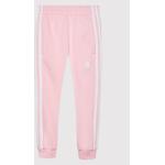 Przecenione Różowe Spodnie dziecięce dresowe marki adidas 