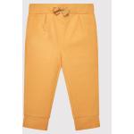 Przecenione Żółte Spodnie dziecięce dresowe marki Coccodrillo w rozmiarze 68 