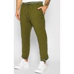 Przecenione Zielone Spodnie dresowe męskie rurki marki Guess w rozmiarze M 