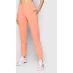 Przecenione Pomarańczowe Spodnie dresowe damskie marki Guess w rozmiarze XL 