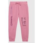 Przecenione Różowe Spodnie dziecięce dresowe marki Hummel w rozmiarze 116 
