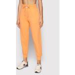 Przecenione Pomarańczowe Spodnie dresowe damskie sportowe marki New Balance w rozmiarze M 