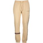 Beżowe Spodnie dresowe męskie marki Tommy Hilfiger w rozmiarze L 