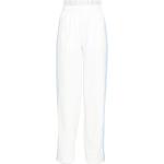 Białe Spodnie sportowe damskie w paski luźne na wiosnę marki adidas w rozmiarze L 